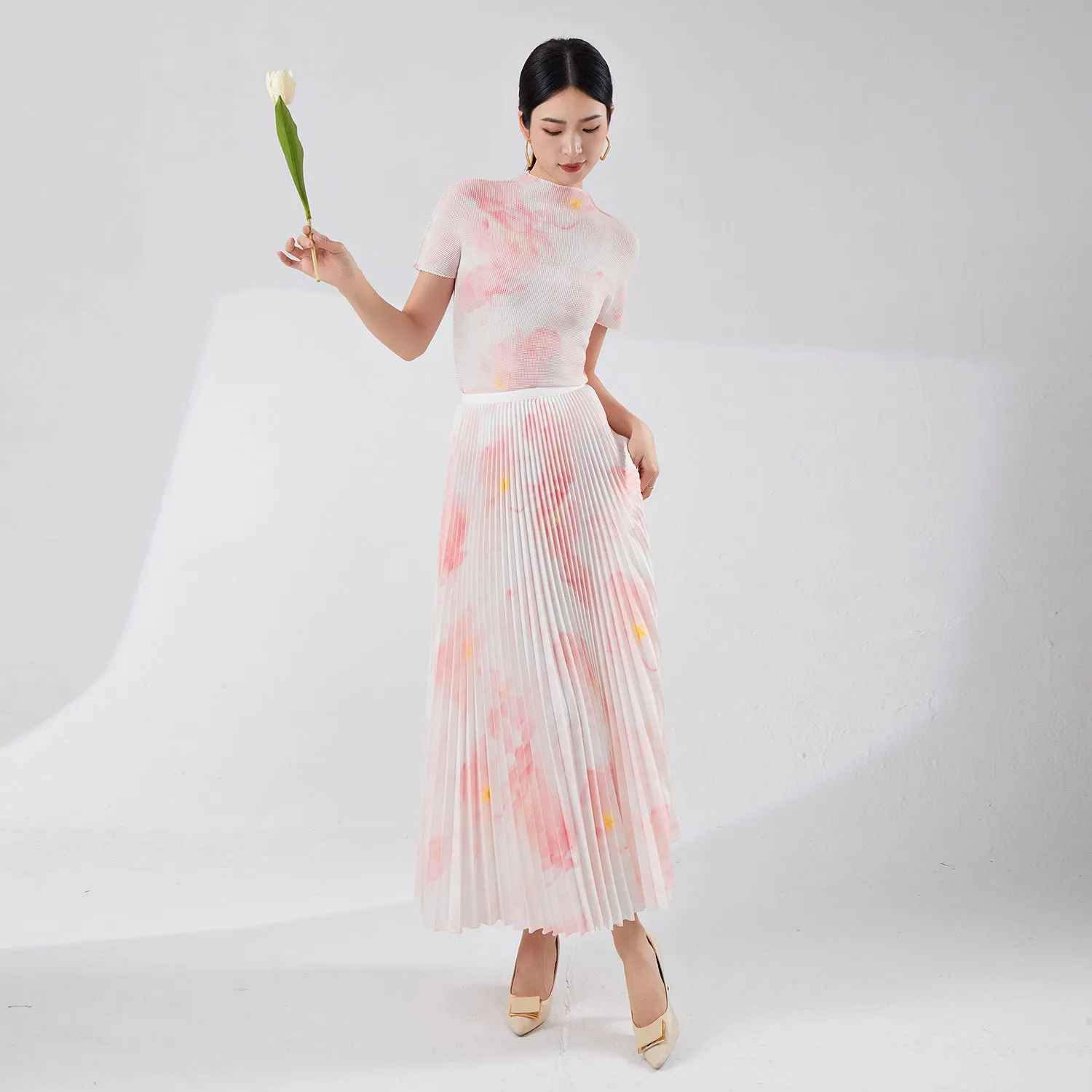 2025 Tall summer temperament suit women's two-piece set Nanyou high-end women's clothing printed short-sleeved pleated top skirt
