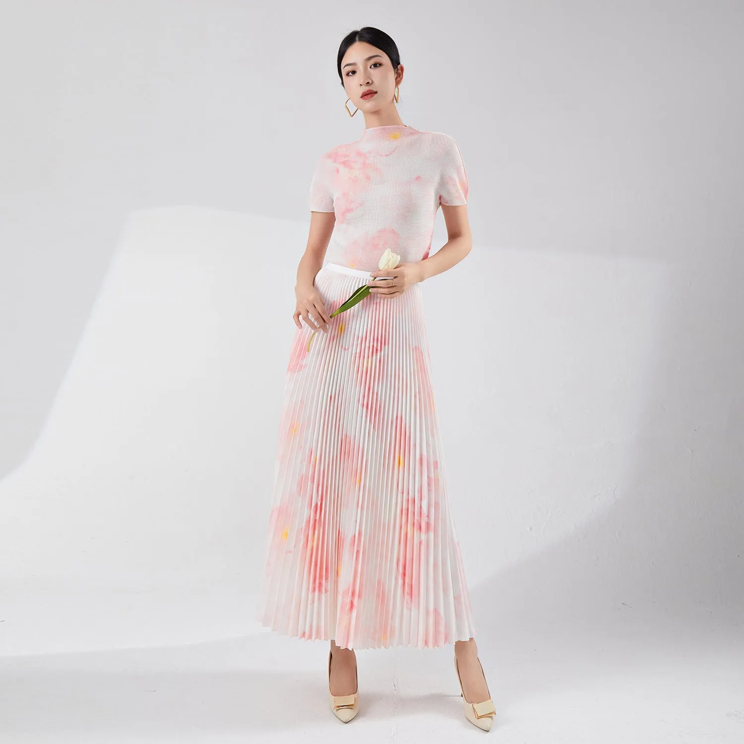 2025 Tall summer temperament suit women's two-piece set Nanyou high-end women's clothing printed short-sleeved pleated top skirt
