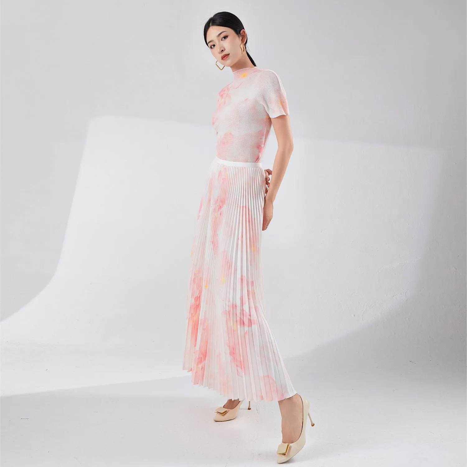 2025 Tall summer temperament suit women's two-piece set Nanyou high-end women's clothing printed short-sleeved pleated top skirt