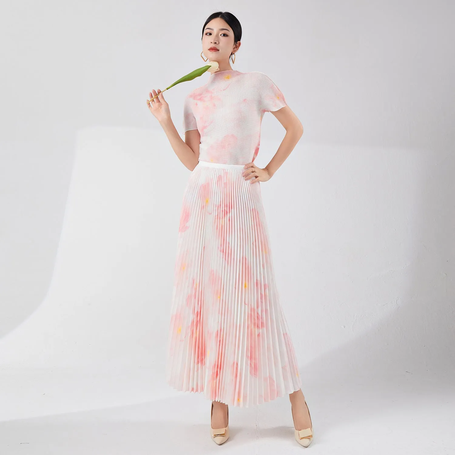 2025 Tall summer temperament suit women's two-piece set Nanyou high-end women's clothing printed short-sleeved pleated top skirt