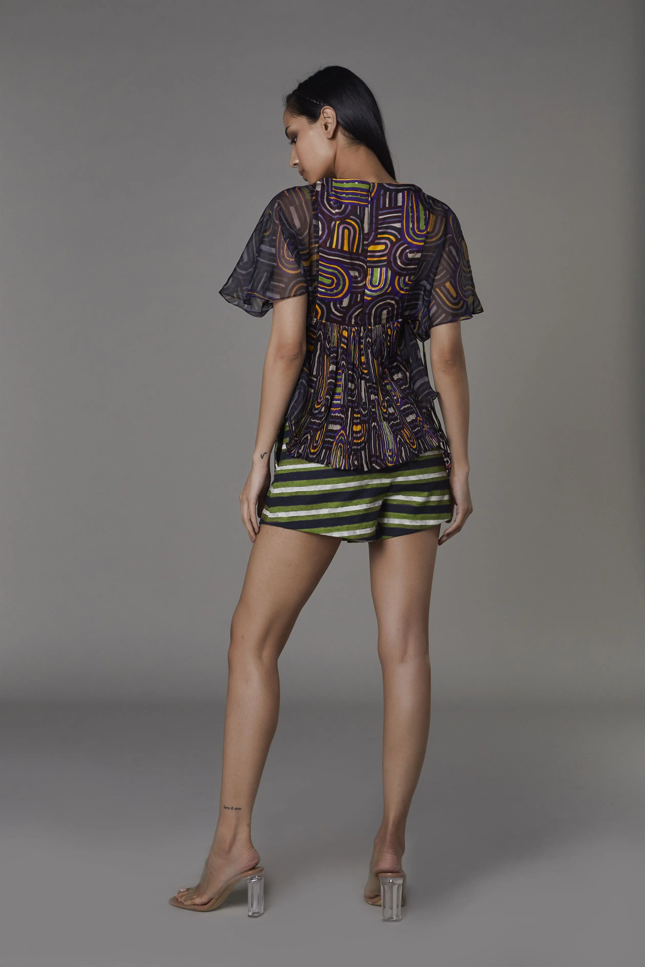 Saaksha & KinniÂ    I   Purple semi circle bustier kedia  Green stripe shorts Blouse - Satin / Chiffon / Organza  Shorts - Satin Blouse - Purple  Shorts - Green / Black   SS22124    SS22096